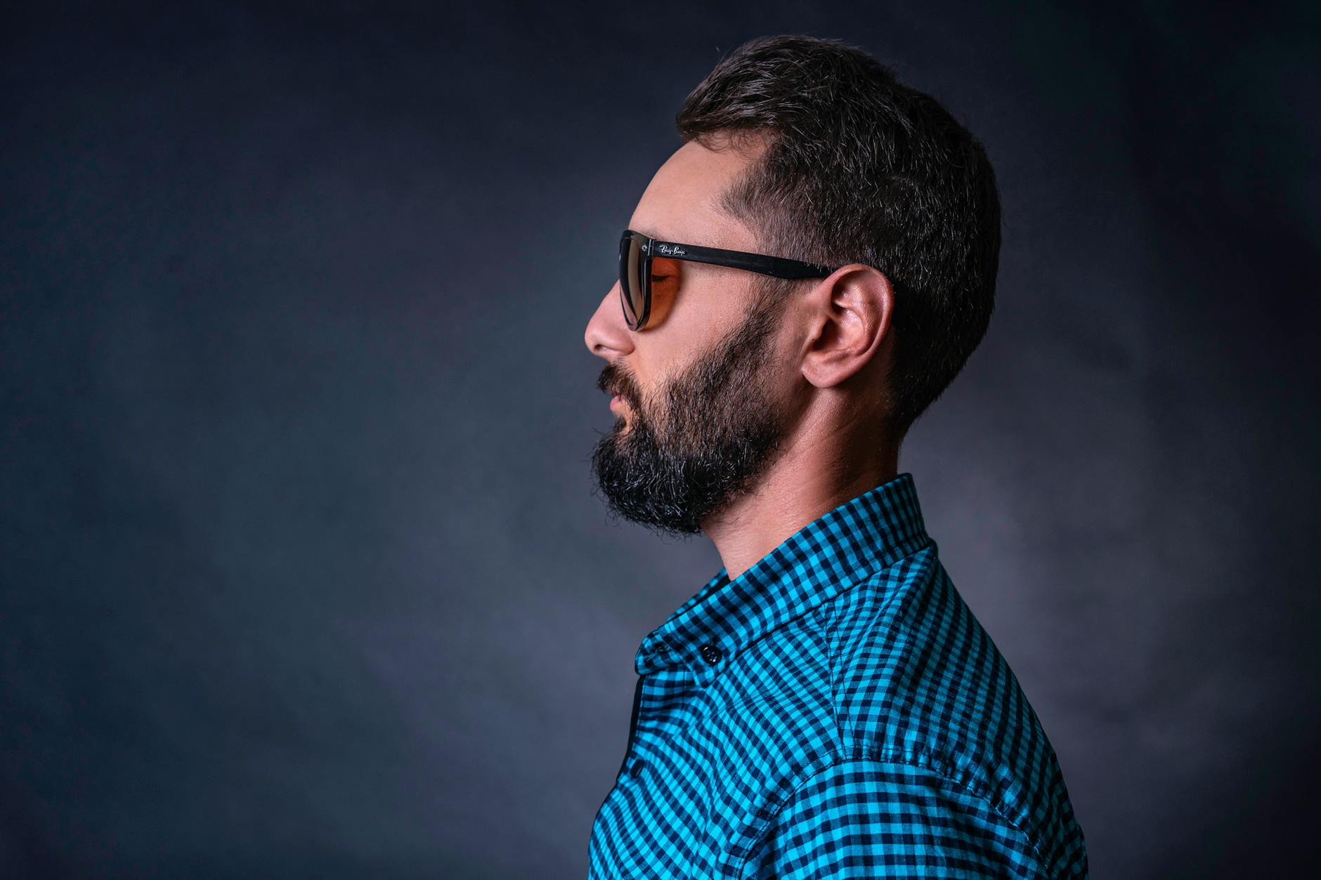 man wearing checkered shirt